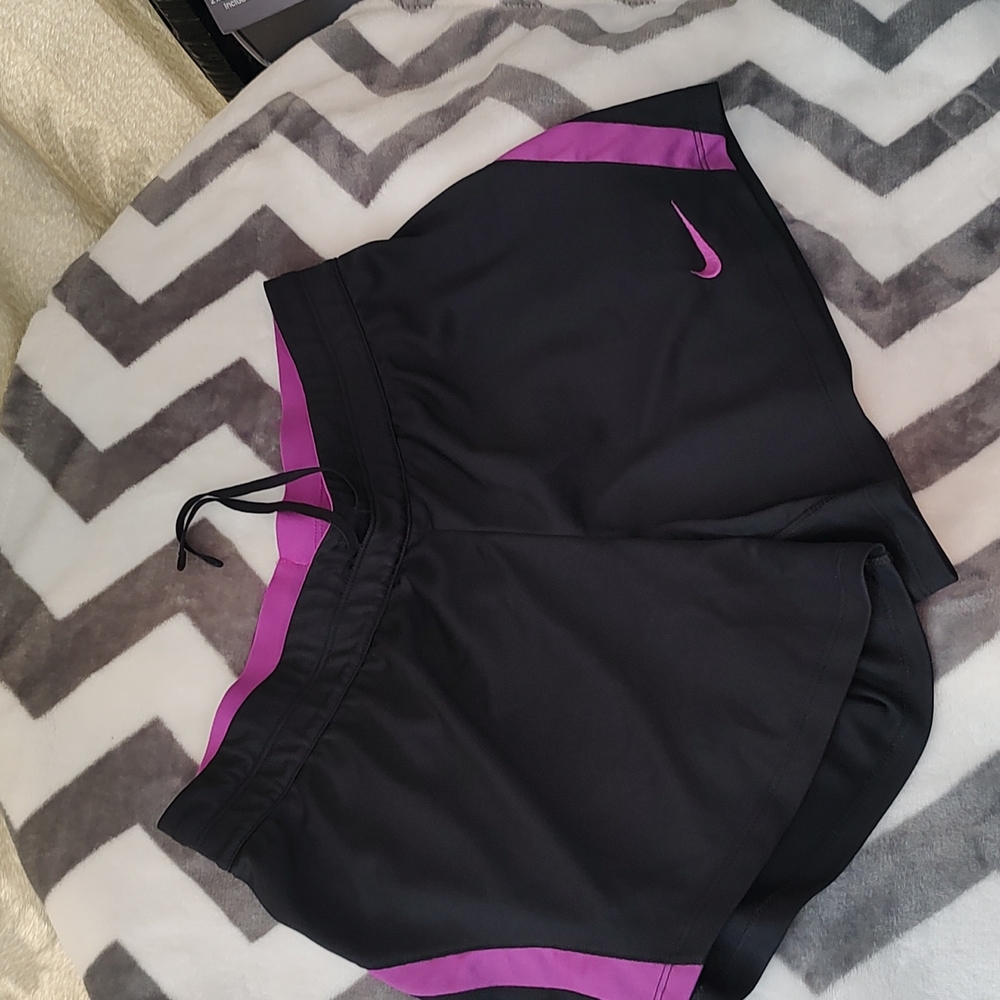 Nike shorts. Black w magenta trim. New condition. Size Small.